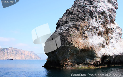 Image of Rocks and endless sea with clear blue sky