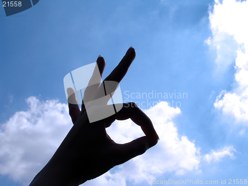 Image of Ok Sign with cloud background