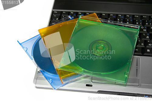 Image of Colored cd`s on a laptop
