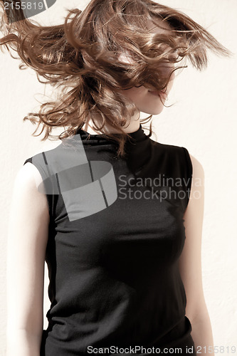 Image of Fashion portraits of a model with awesome shaking hair