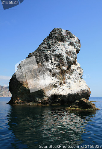 Image of Rocks and endless sea with clear blue sky