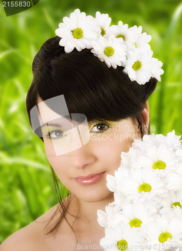 Image of Girl with spring flowers.Glamor effect.