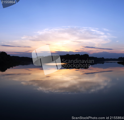 Image of Romantic sunset on the lake with fog