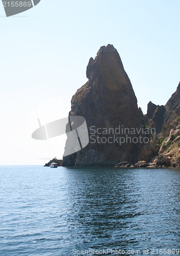 Image of Rocks and endless sea with clear blue sky