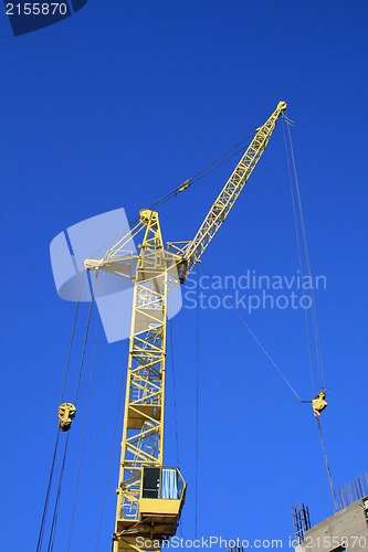 Image of Construction site with yellow crane