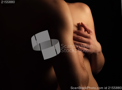 Image of Hands hugging a girl in passion