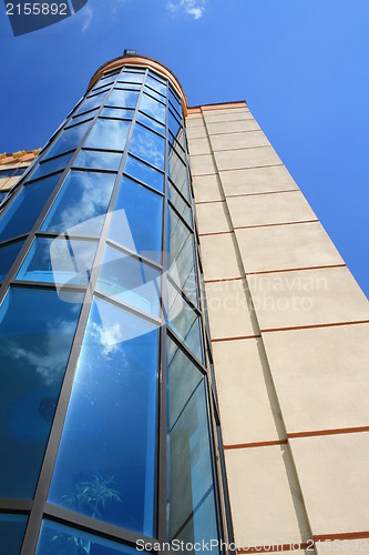 Image of Modern building - hotel with clouds reflecting in it`s windows