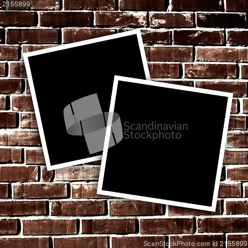 Image of Empty instant photos on grunge brick wall background