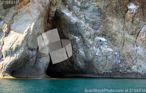 Image of Rocks and endless sea with clear blue sky