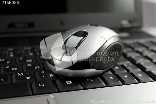 Image of Mouse on a laptop keyboard