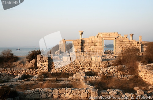 Image of Ancient ruins near the sea at sunset