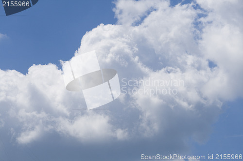 Image of Puffy clouds on blue sky