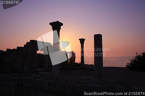 Image of Ancient ruins during sunset with sea at background