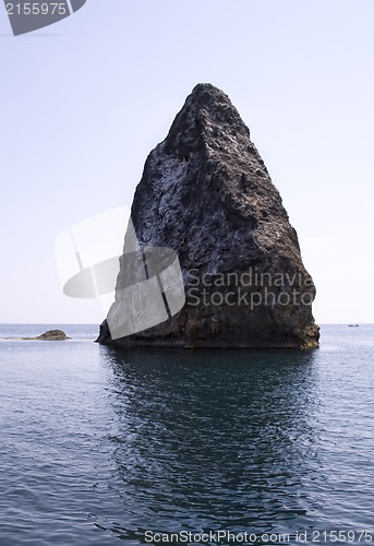 Image of Rocks and endless sea with clear blue sky