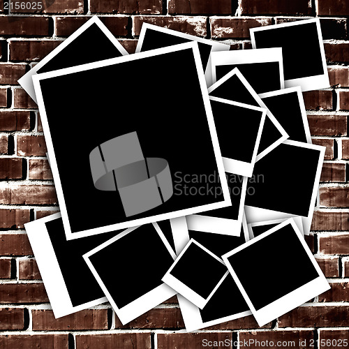Image of Empty instant photos on grunge brick wall background