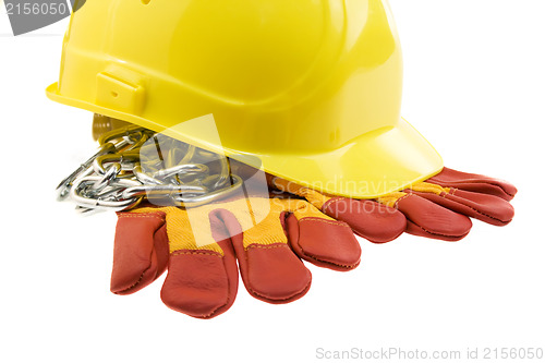 Image of Yellow hard hat, protective gloves and steel chain isolated