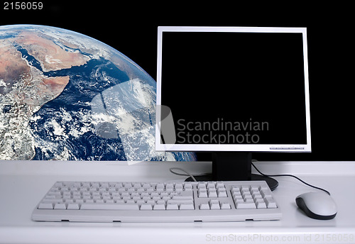 Image of PC with earth background and black desktop