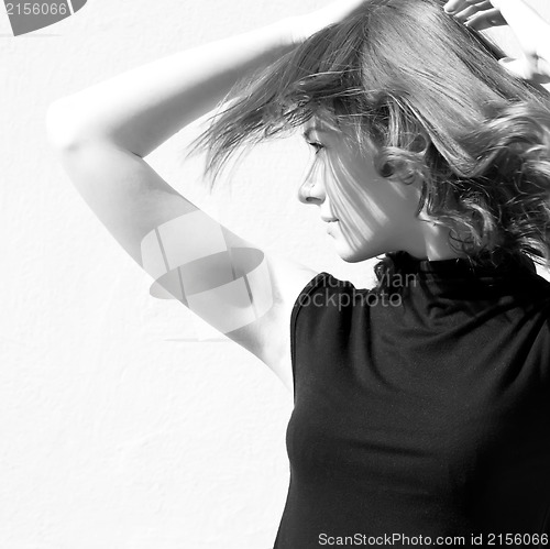 Image of Fashion portraits of a model with awesome shaking hair