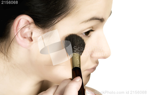 Image of Sexy girl putting make-up