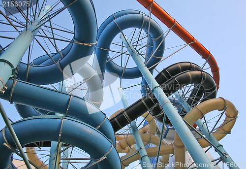 Image of Twisting, colorful water chutes wind around