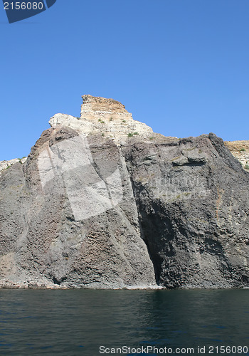 Image of Mountain on a rocky coastline.View from sea.