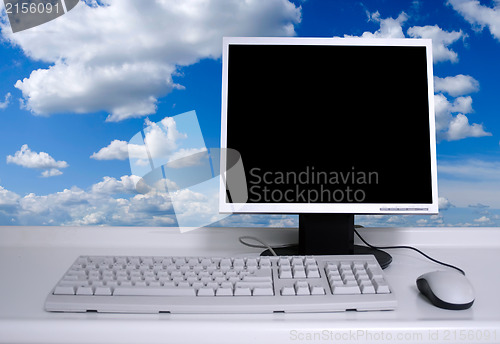 Image of PC with clouds background
