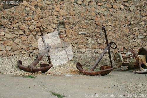 Image of Old rusty anchor on the ground
