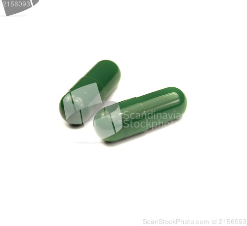 Image of Two green pills isolated
