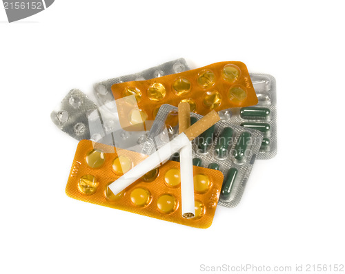 Image of Cigarettes and pills isolated.Illnesses from cigarettes concept