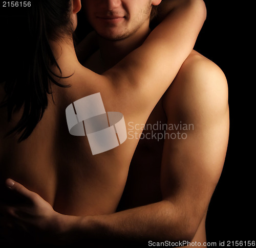 Image of Hands hugging a girl in passion