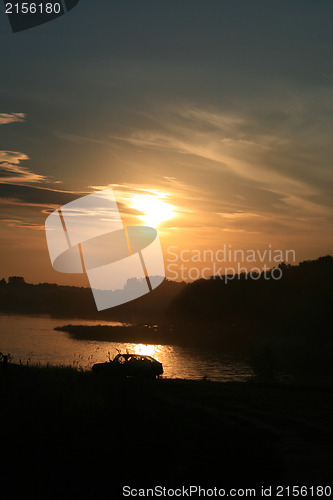 Image of Car near the sunset lake