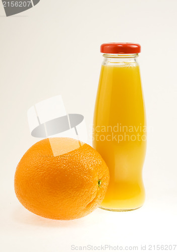 Image of Orange juice bottle with orange fruit. The file includes clippin