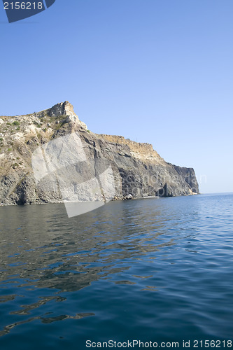 Image of Mountain on a rocky coastline.View from sea.