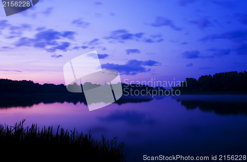 Image of Romantic sunset on the lake with fog