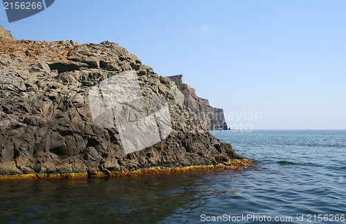 Image of Mountain on a rocky coastline.View from sea.