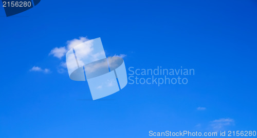 Image of Clear blue sky with one little cloud