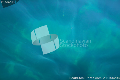 Image of Rays of light falling into the sea.Close up to the waves surface