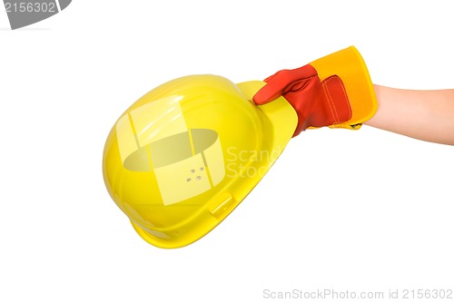 Image of Hand in glove holding a yellow hard hat isolated
