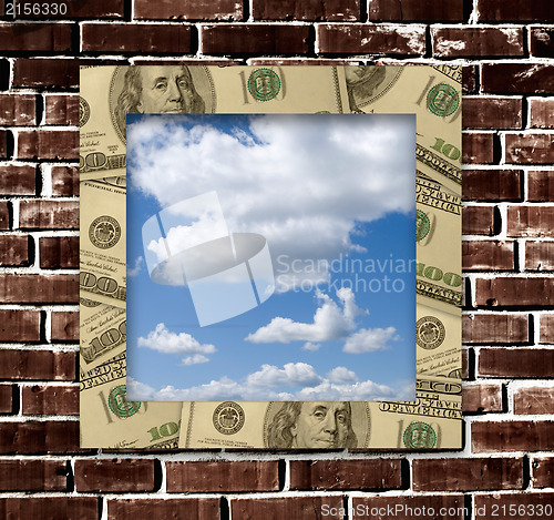 Image of Dollars frame with sky image inside and grunge wall background