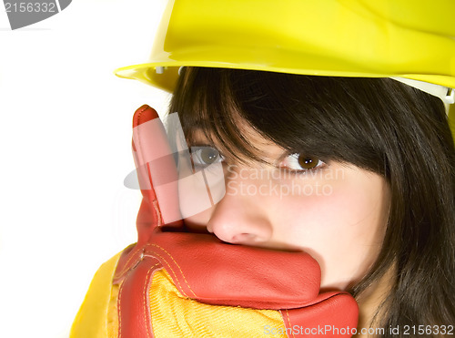 Image of Girl in yellow hard hat and red gloves get shy isolated