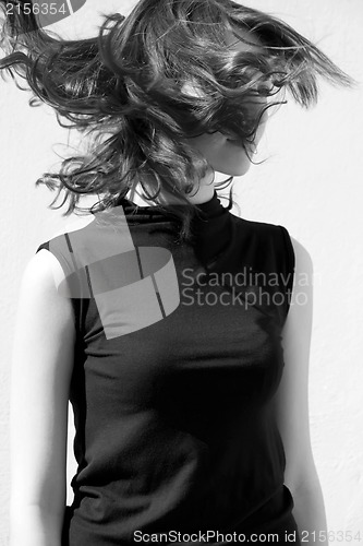 Image of Fashion portraits of a model with awesome shaking hair