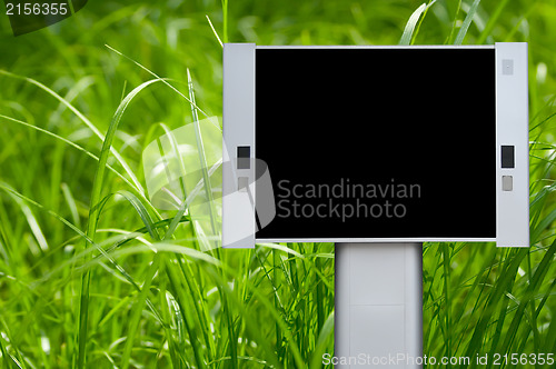 Image of Blank advertising billboard with green grass background