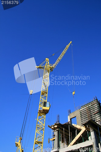 Image of Construction site with yellow crane