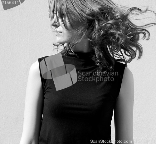 Image of Fashion portraits of a model with awesome shaking hair