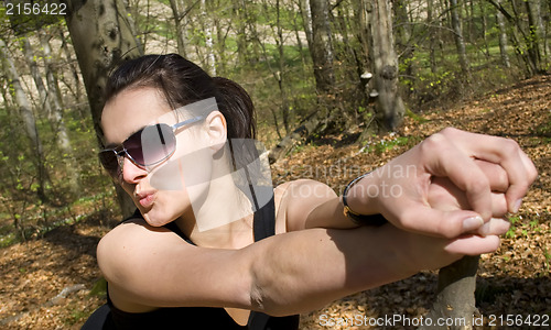 Image of Young woman in the forest