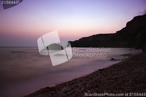 Image of Sunset sea rocky beach