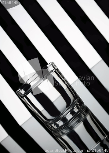 Image of Glass of water with striped background
