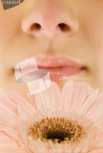 Image of Smelling a spring flower