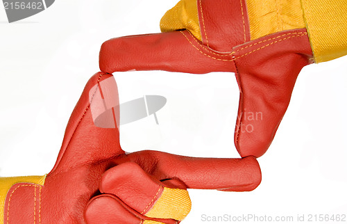 Image of Frame made from red protective gloves