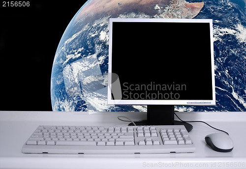 Image of PC with earth background and black desktop